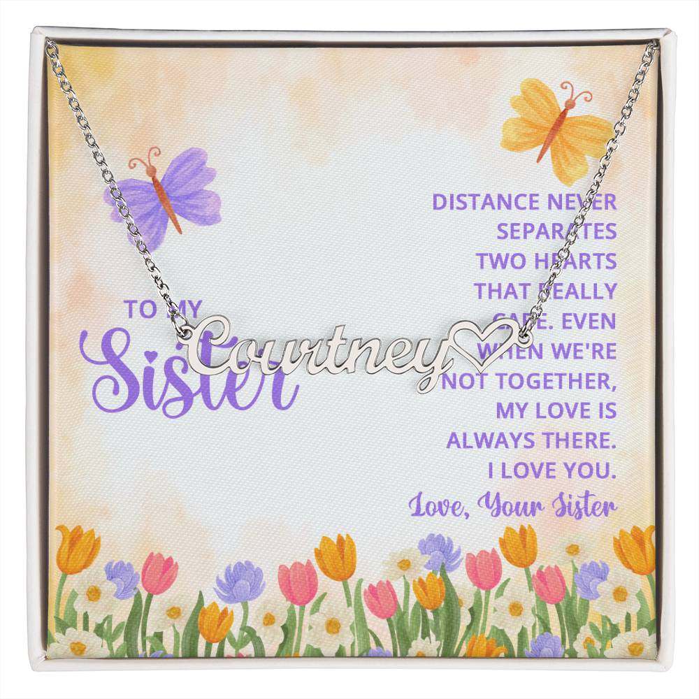 Customized heart name necklace for sister, featuring a cursive design, flowers, and butterflies.